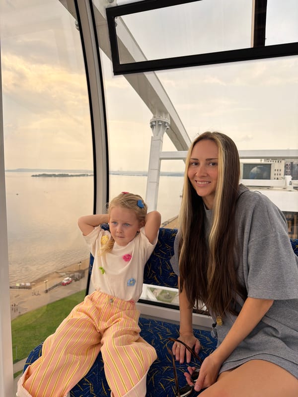 Woman and child enjoy Ferris wheel ride in Saratov
