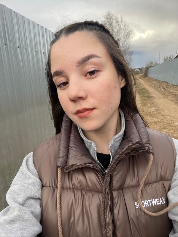 Young person takes outdoor selfies in Ольховка, Russia