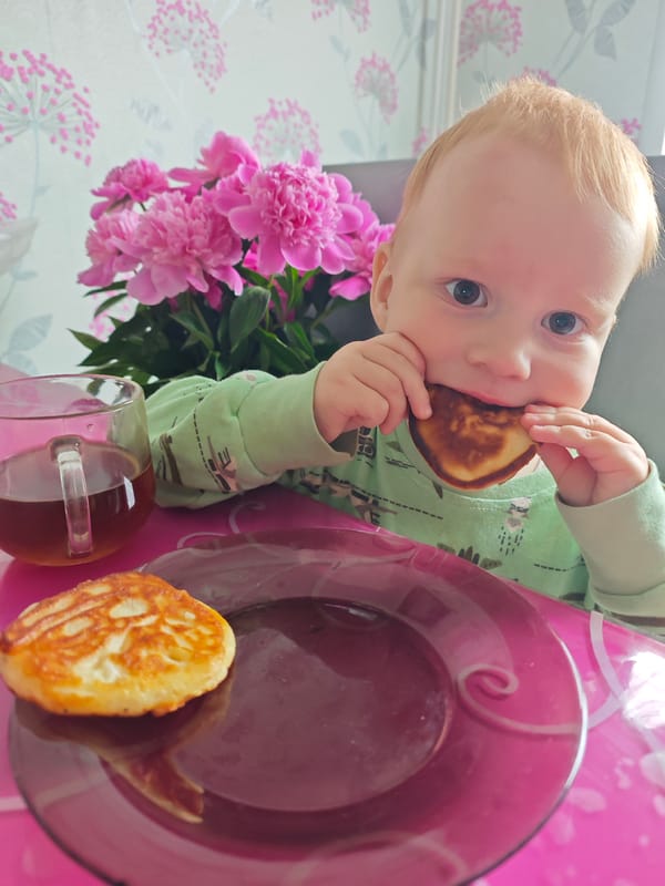 Toddler photographed during early morning meal in Markovskii home