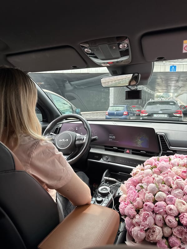 Woman drives through heavy traffic in Almaty