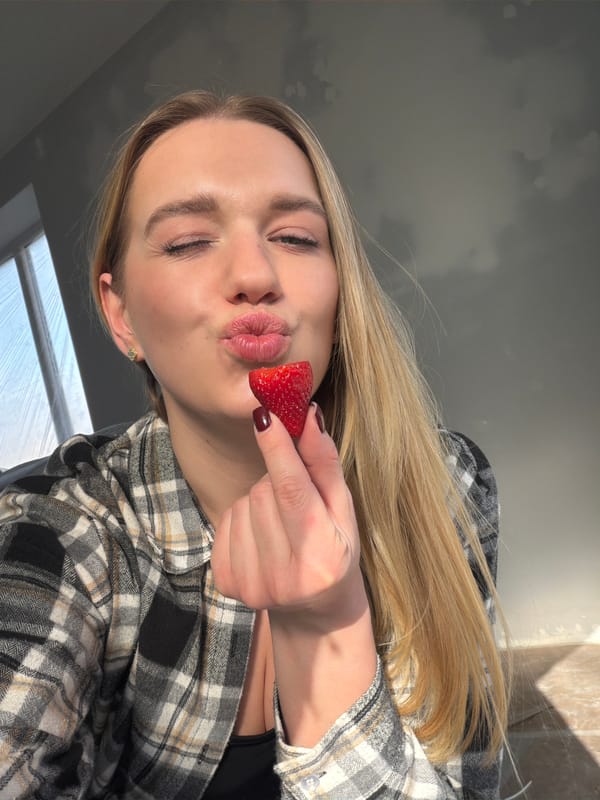 Woman enjoys strawberries and bubble tea in Latvia
