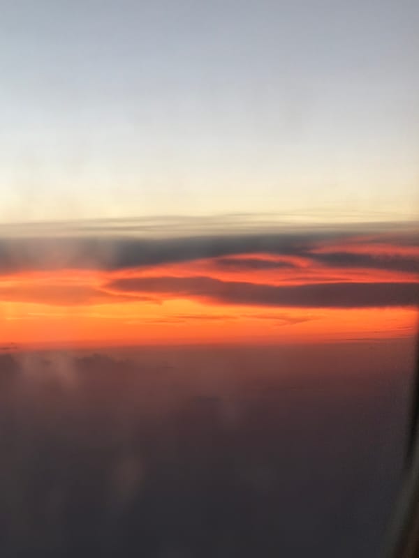 Orange sunset captured with vertical clouds in Choeng Thale