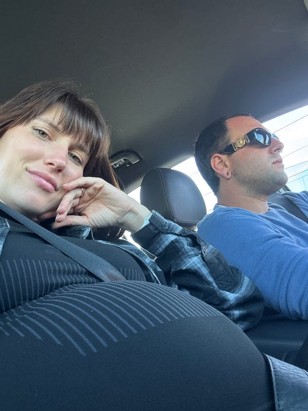 Woman photographed smiling in car in Anzio, Italy