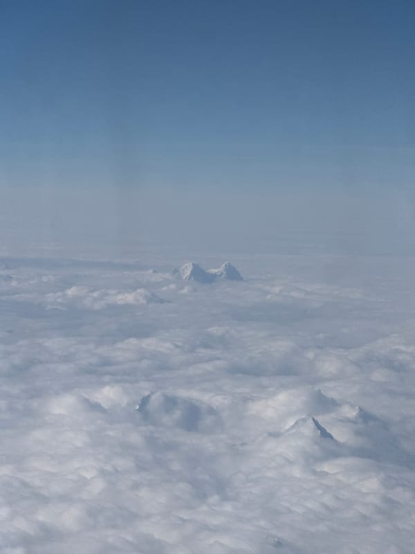 Passenger documents aerial mountain views from flight over Tibet
