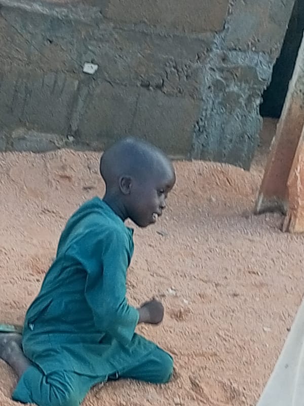 Moments on sandy ground in Tempure, Nigeria