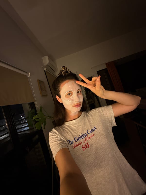 Woman takes selfie with face mask in Tel Aviv