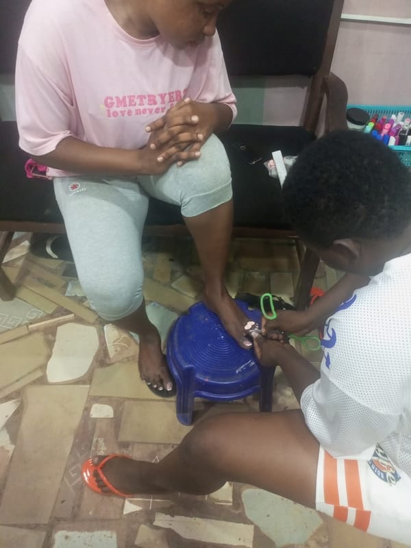 Indoor pedicure session between two people documented