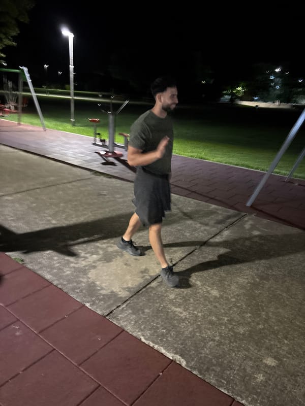 Man exercises at outdoor fitness park in Dobrich, Bulgaria