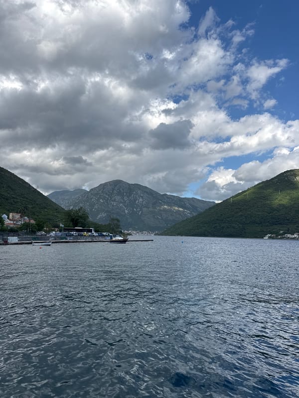 Boats docked at pier in Montenegro waterscape observed