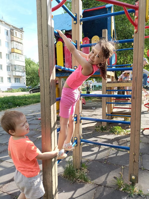 Children play at Chaikovsky playground during family outing