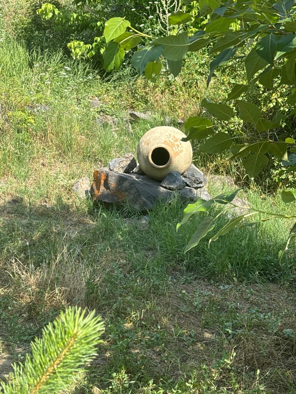 Ancient amphora and hilltop ruins on a summer day in Malishka
