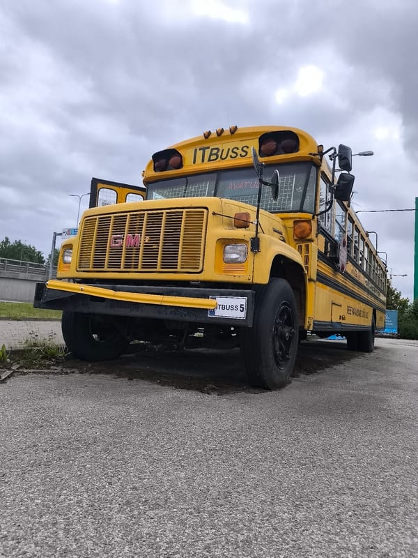 American school bus spotted in Tallinn amid spring blooms