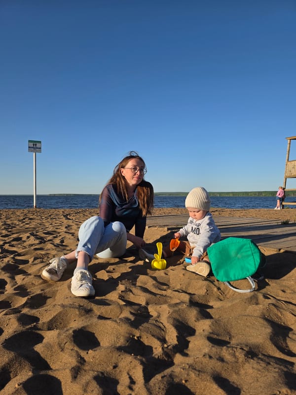 Mother and toddler enjoy beach afternoon in Chaikovsky, Russia