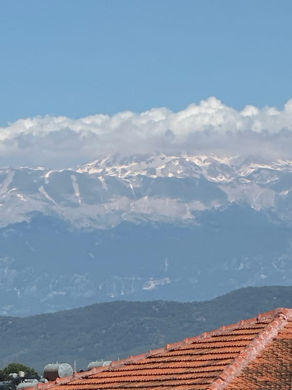 Clear skies frame mountain views in Turkish coastal town