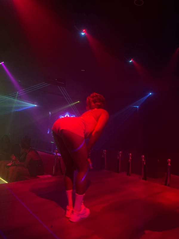 Late-night club performance under heavy stage lighting in Howayi, Nigeria