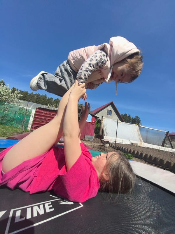 Family enjoys spring morning trampoline play in Noviy, Russia