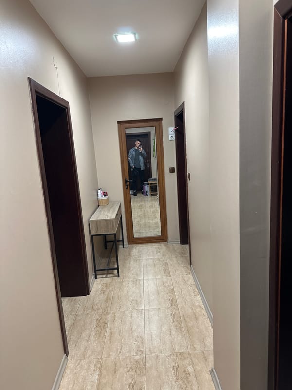 Person takes mirror selfie in Blagoevgrad building interior