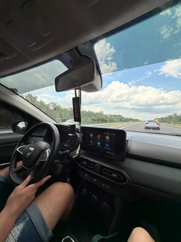 Driver makes peace sign gesture in car, Bulgaria