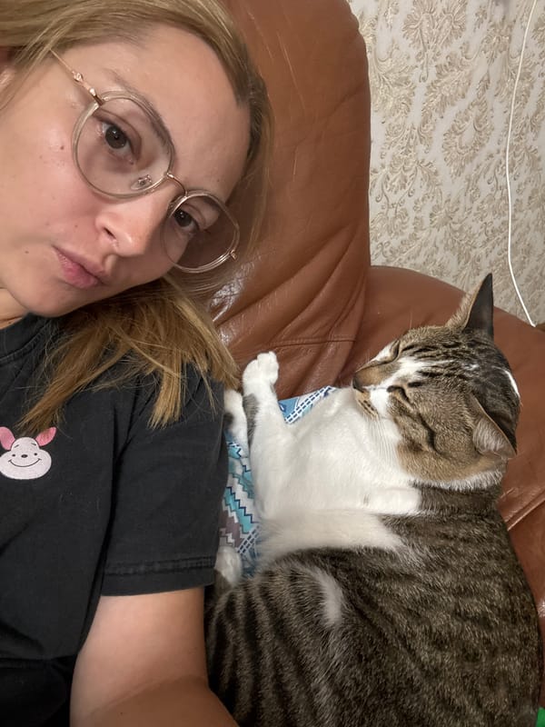 Close-up selfies, indoors and out, graphic tee and glasses