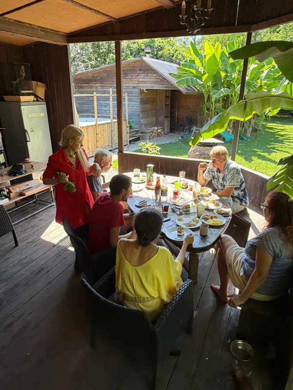 Casual outdoor meal on a wooden porch in Sochi