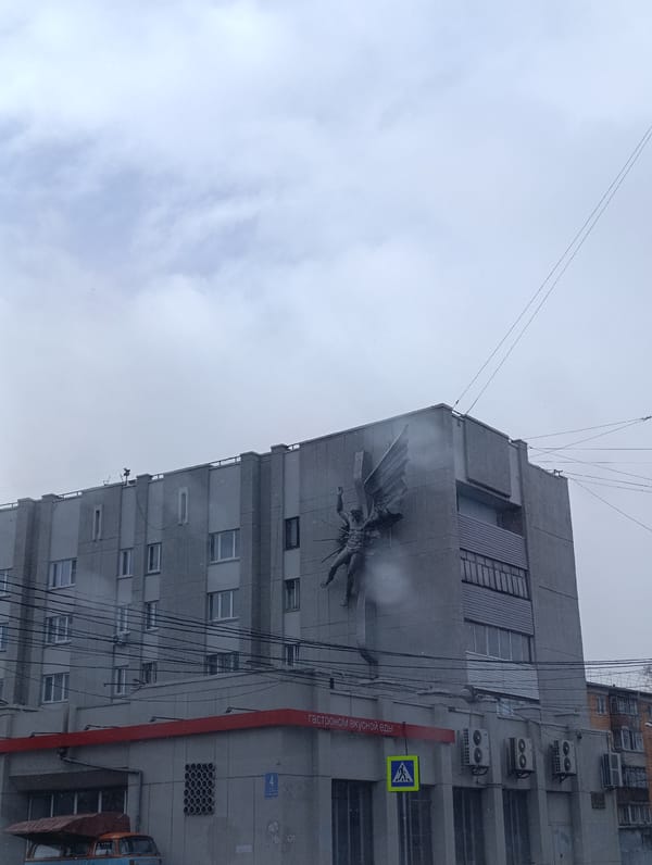 Gray building with relief sculpture documented in Krasnoyarsk