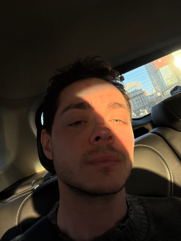 Man seated in car during daylight in Moscow