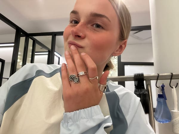 Person with piercings, rings photographed upside-down in Whistler