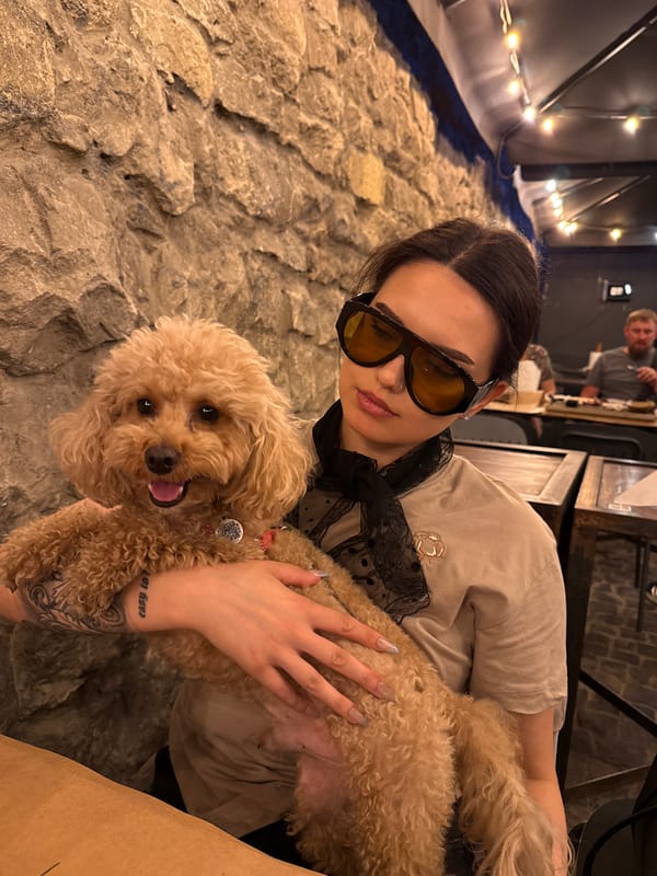 A summer evening wandering Lviv's old town with food, drinks, and a poodle