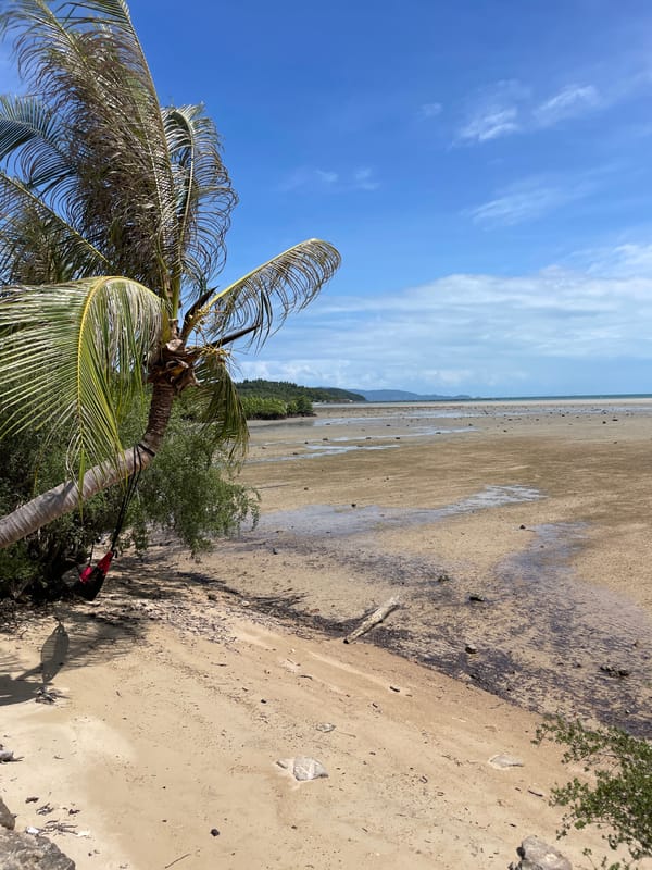 Low tide exposes wide sand flats at Thai beach