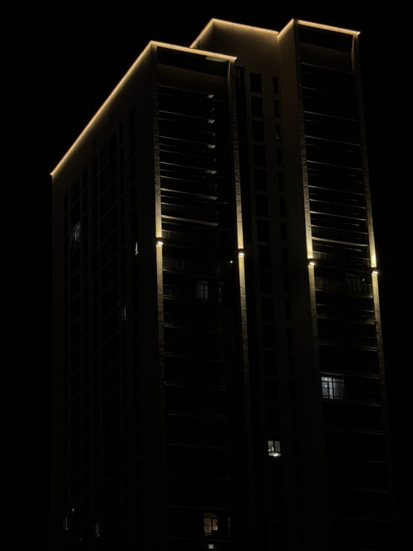 Modern Yekaterinburg building lit up at night