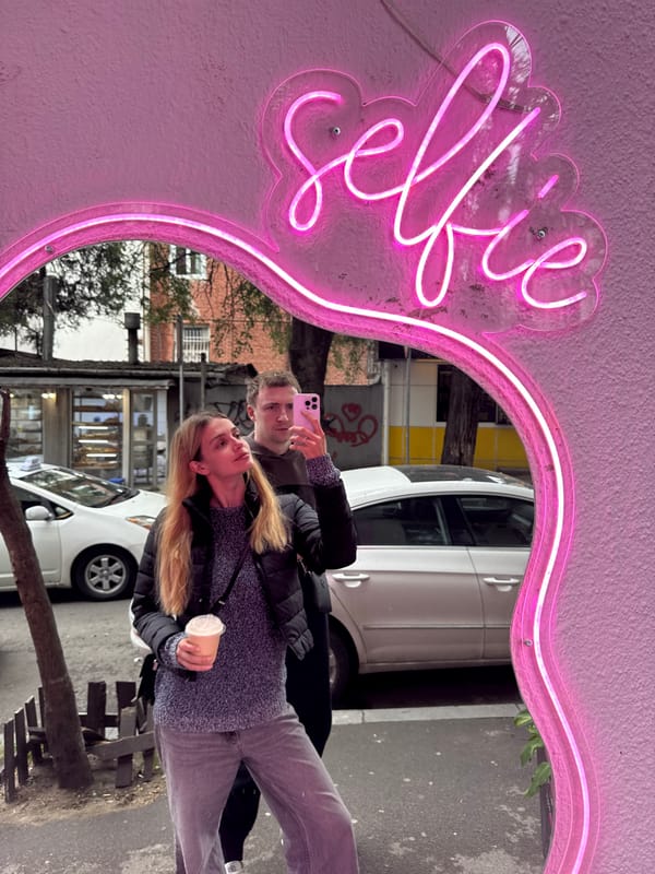 Woman takes selfies during casual walk through Tbilisi streets