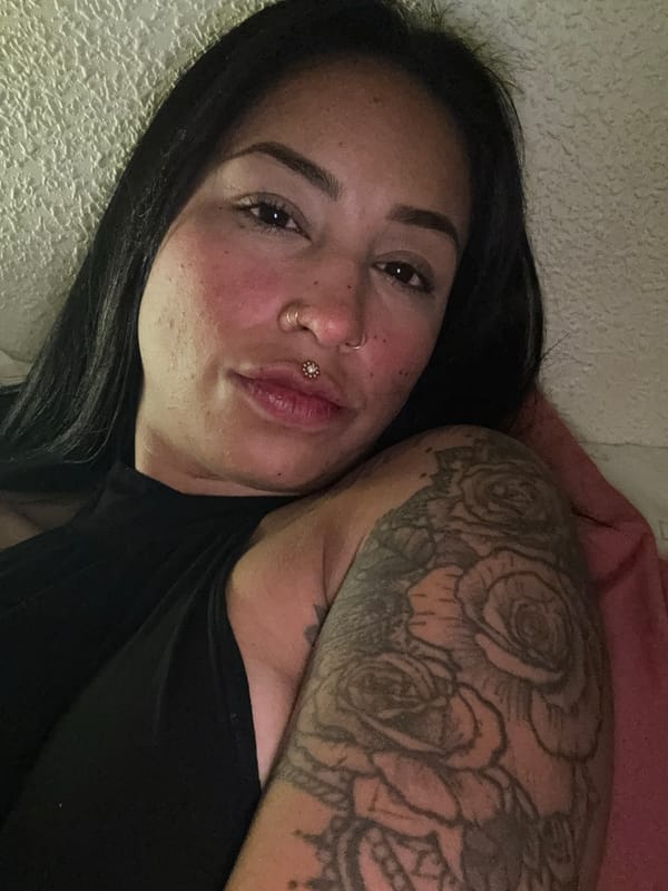 Woman with tattoos and piercings resting in Murcia