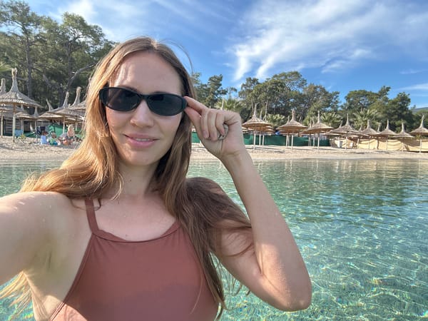 Woman takes swimming selfie at Fethiye beach