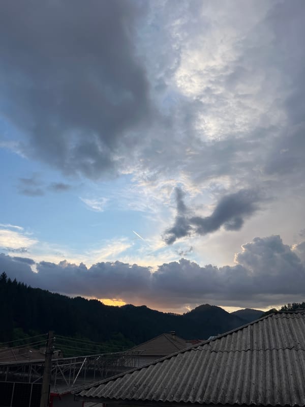 Aircraft contrail spotted over Chepintsi during mountain sunset