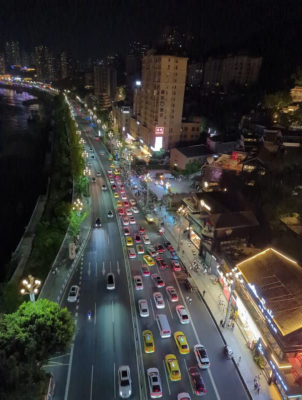 Chongqing at night: rivers, roads, and glowing hillsides