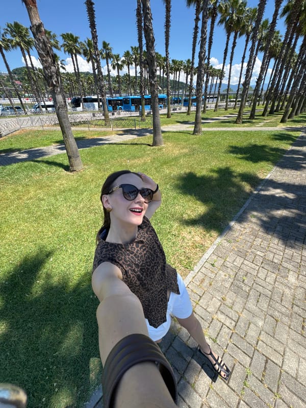 Sunny afternoon poses along a palm-lined promenade in Sirius