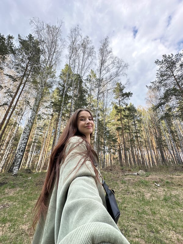 Woman takes forest selfie amid birch trees in Yekaterinburg