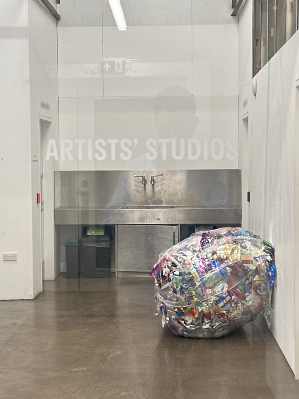 Artist studio workspace documented in London with materials collection