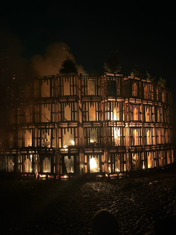 Torchlight ceremony features massive wooden pallet bonfire in Luxembourg