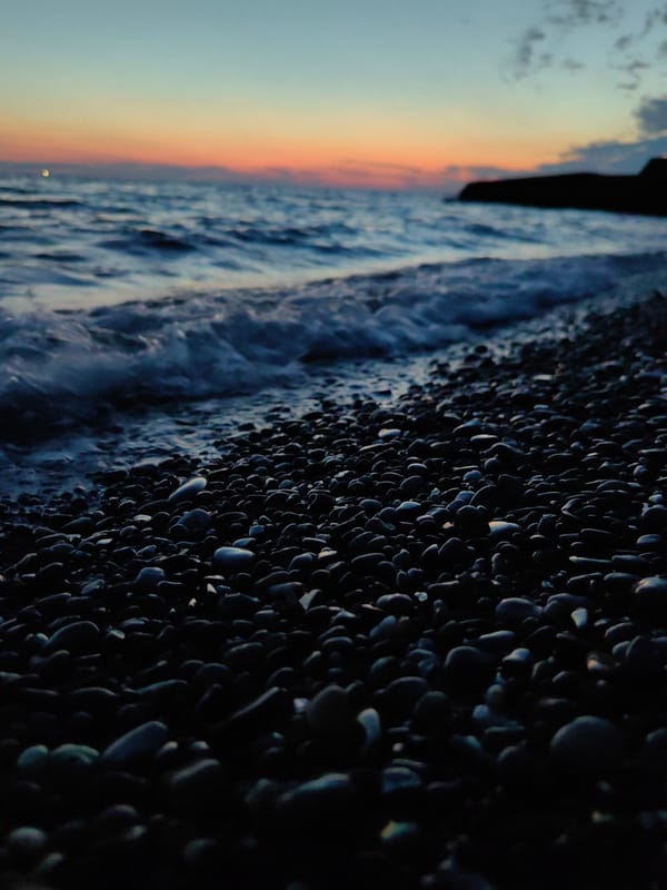 Evening stroll documented along Sochi's Black Sea coastline at dusk
