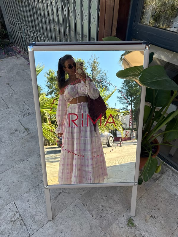 Woman documents selfie session amid bougainvillea in Bodrum, Turkey