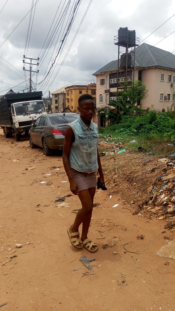 Daily life unfolds on dirt roads in Obosi, Nigeria