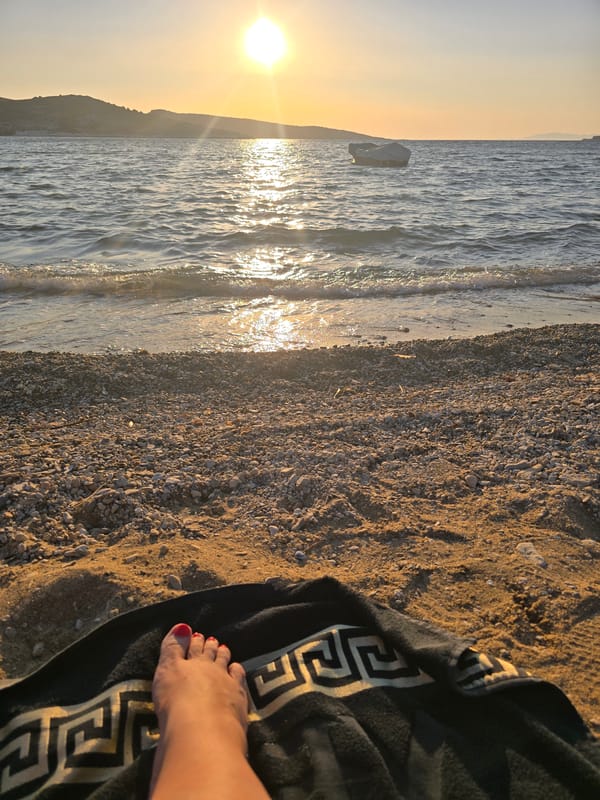 Sunset wind-down on a pebbly Aegean beach in Foça