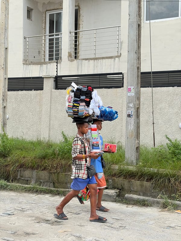 Street commerce and deliveries moving through Igboefon, Lagos