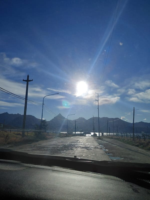 Wet roads and sunlight reflections captured in Ushuaia