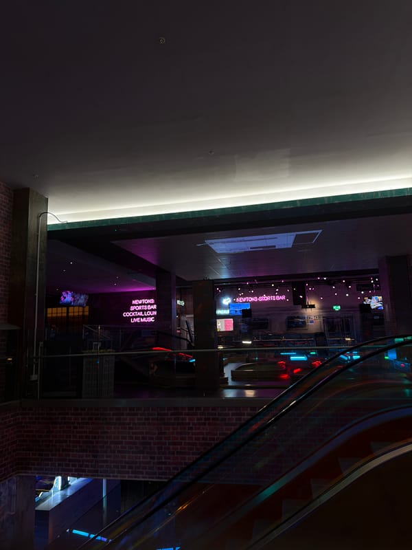 Indoor entertainment venue captured in evening lighting setup