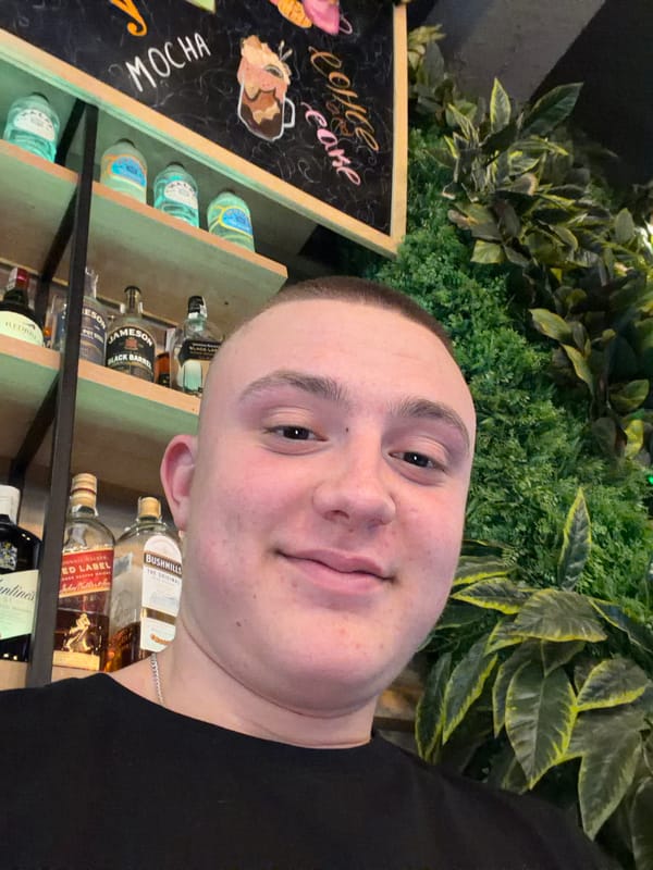 Man takes selfie against decorative wall in Burgas