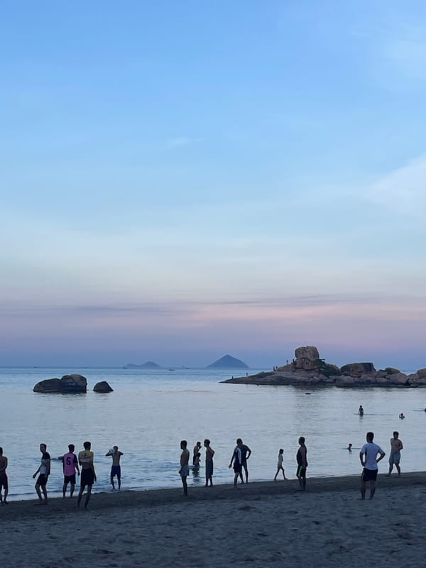 Beach soccer and swimming at Nha Trang shoreline