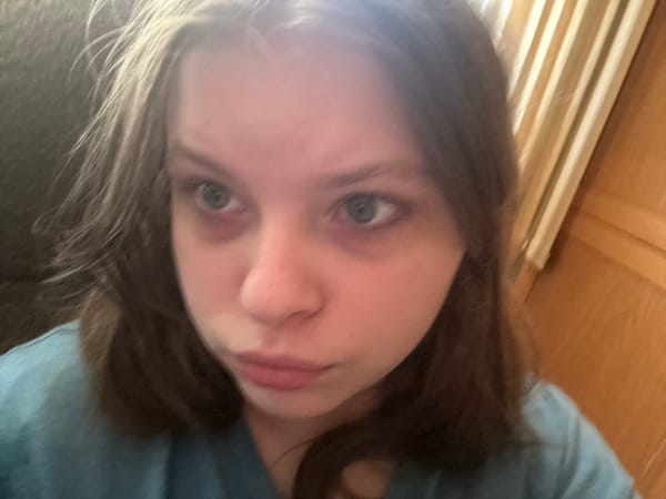 Woman takes multiple selfies at home in Moscow