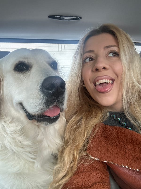 Woman takes selfies with white dog in London